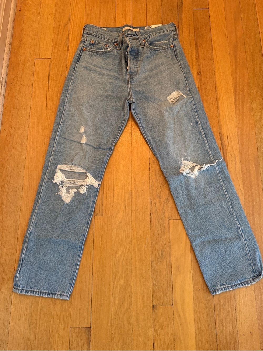 Levi's Light Blue Distressed Boyfriend Jeans with Knee Rips